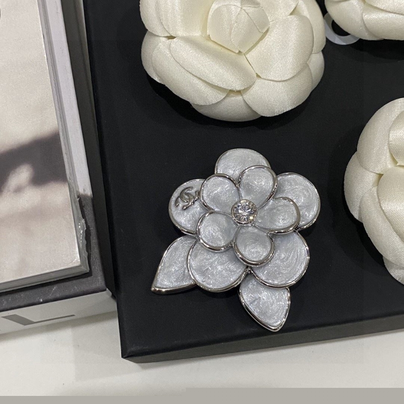 Ch*el brooches